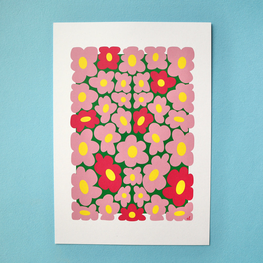 A printed artwork featuring a whimsical pattern of wobbly pink daisies on a blue background