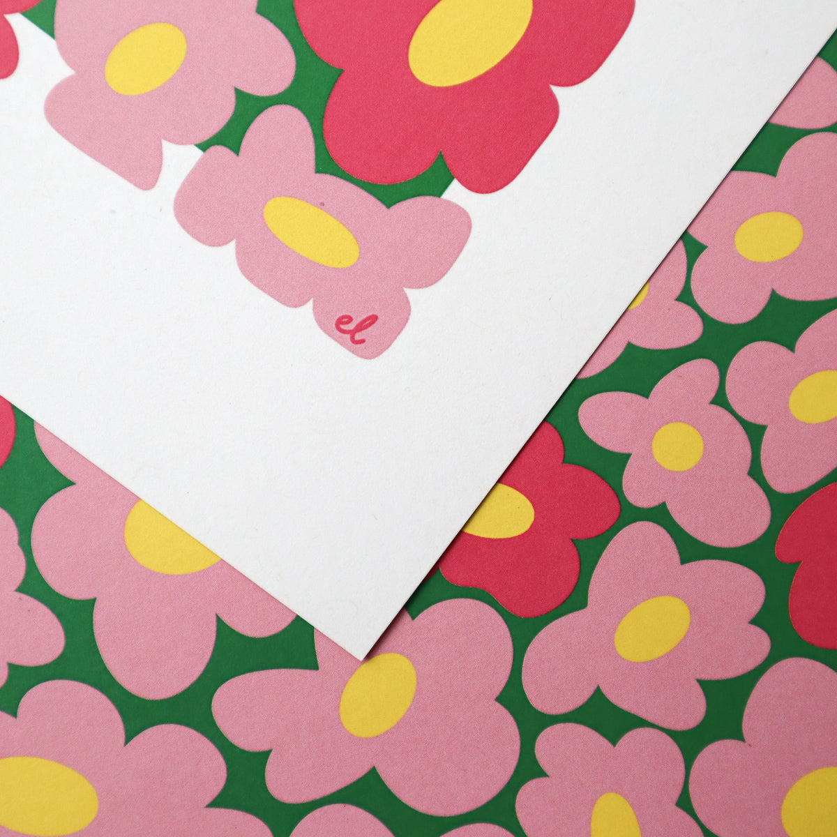 A printed artwork featuring a whimsical pattern of wobbly pink daisies